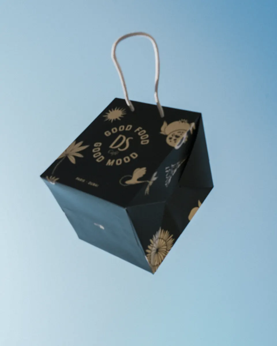 DS Café Good Food Good Mood bag against the sky