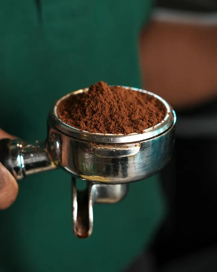 Freshly ground coffee in the portafilter